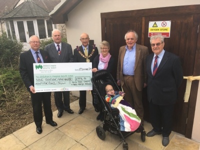 Peter Balsom cuts the ribbon with Henry Dunn, aged 4, watched by fellow Masons Trevor Jenkins, Brett Varker and Paul Howard-Baker, CHSW Chief Executive Eddie Farwell and head of care Tracy Freame. Peter Balsom cuts the ribbon with Henry Dunn, aged 4, watched by fellow Masons Trevor Jenkins, Brett Varker and Paul Howard-Baker, CHSW Chief Executive Eddie Farwell and head of care Tracy Freame.